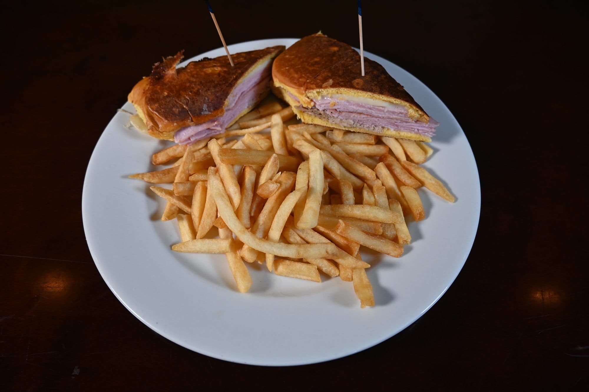 Cuban Sandwich pressed on Cuban bread, served with french fries